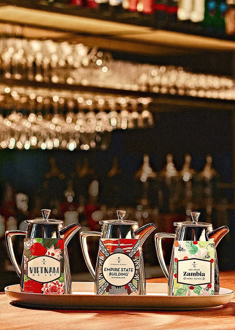 A trio of coffee pots and coffee cards.