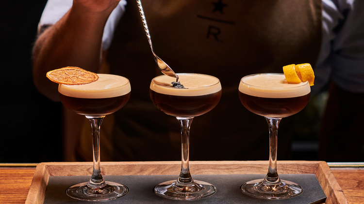 An espresso martini flight being garnished.
