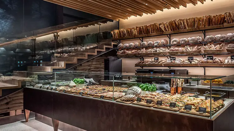 Princi Bakery in the Tokyo Roastery displaying a variety of breads, sandwiches, pastries and vegetables